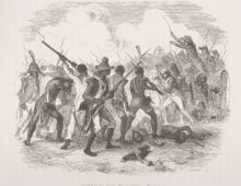 A black and white engraving showing a battle scene between Haitian and French armies. Many bayonets and swords can be seen and on the right hand side of the image a European soldier stands on a cannon wielding a sword.